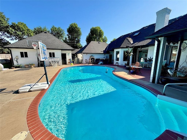 1118 Fernwood Dr, Midwest City, OK 73130 - view of swimming pool featuring a patio