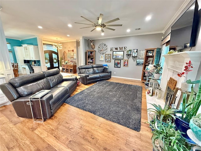 1118 Fernwood Dr, Midwest City, OK 73130 - living area with ceiling fan, a fireplace, a chandelier, recessed lighting, and crown molding