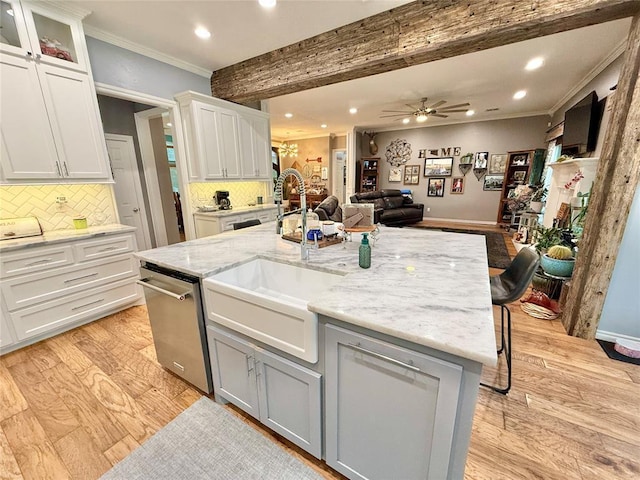 1118 Fernwood Dr, Midwest City, OK 73130 - kitchen with crown molding, recessed lighting, stainless steel dishwasher, open floor plan, and light wood-style flooring