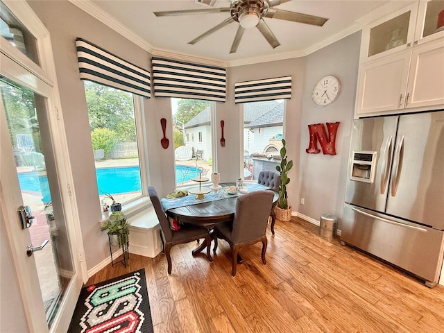1118 Fernwood Dr, Midwest City, OK 73130 - dining area with ornamental molding, light wood-type flooring, and a ceiling fan