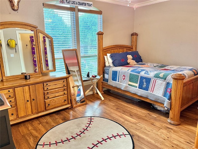 1118 Fernwood Dr, Midwest City, OK 73130 - bedroom with crown molding and wood finished floors