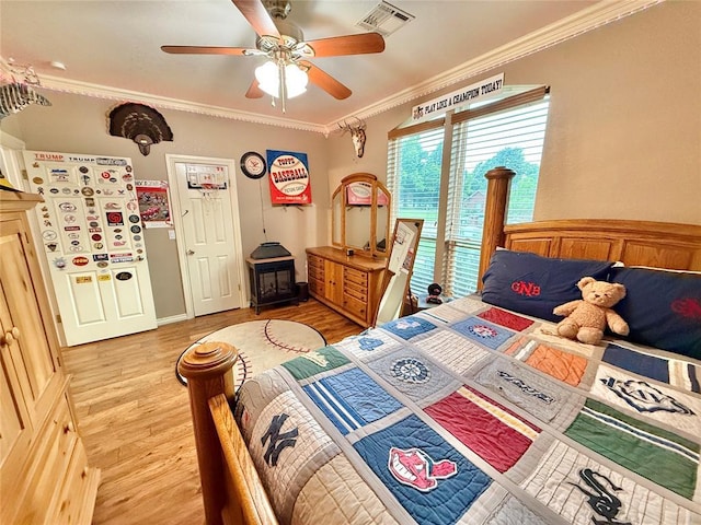 1118 Fernwood Dr, Midwest City, OK 73130 - bedroom featuring light wood finished floors, ornamental molding, and a ceiling fan