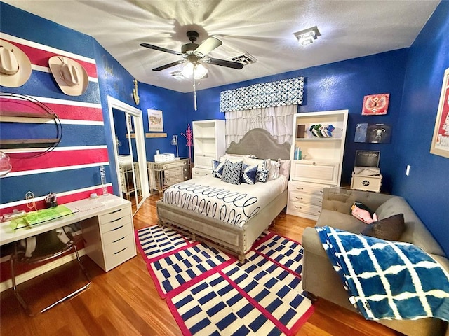 1118 Fernwood Dr, Midwest City, OK 73130 - bedroom with wood finished floors and ceiling fan