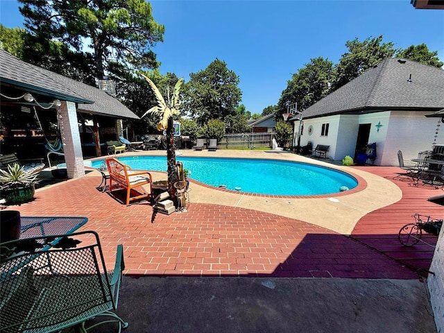 1118 Fernwood Dr, Midwest City, OK 73130 - view of swimming pool with a patio
