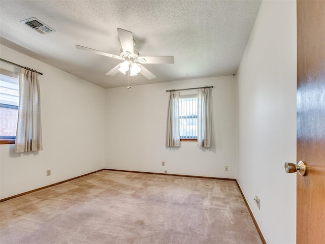 7600 NW 27th St, Bethany, OK 73008 - carpeted empty room featuring a textured ceiling and ceiling fan