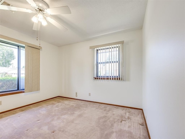 7600 NW 27th St, Bethany, OK 73008 - carpeted spare room featuring baseboards and a ceiling fan