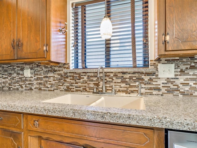 7600 NW 27th St, Bethany, OK 73008 - kitchen featuring tasteful backsplash and brown cabinetry