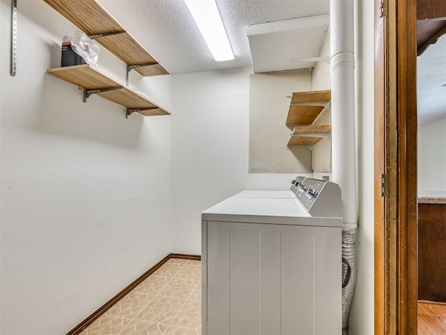 7600 NW 27th St, Bethany, OK 73008 - laundry area featuring independent washer and dryer and baseboards