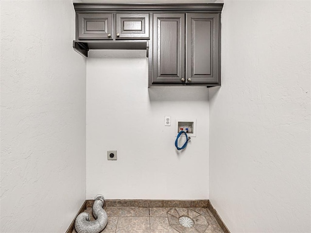 535 N Patchin Ave, Shawnee, OK 74801 - washroom with electric dryer hookup, washer hookup, cabinet space, and tile patterned flooring