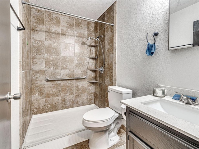535 N Patchin Ave, Shawnee, OK 74801 - full bathroom with vanity, a tile shower, a textured wall, and a textured ceiling