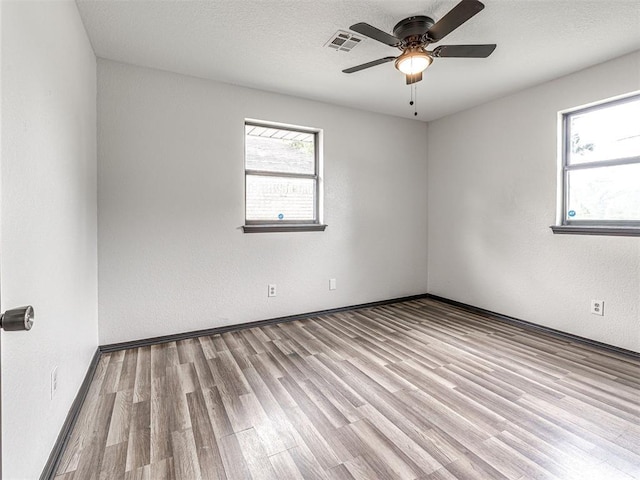 535 N Patchin Ave, Shawnee, OK 74801 - empty room with wood finished floors and a ceiling fan