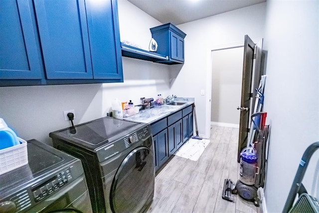 2713 Falling Leaves Dr, Weatherford, OK 73096 - laundry area with cabinet space, separate washer and dryer, and light wood-style floors