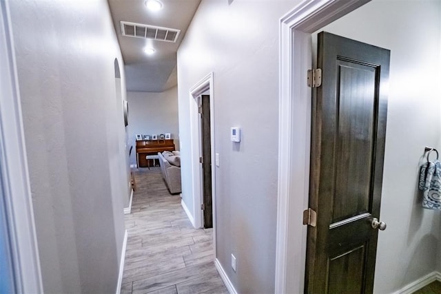 2713 Falling Leaves Dr, Weatherford, OK 73096 - hallway with baseboards and light wood-type flooring