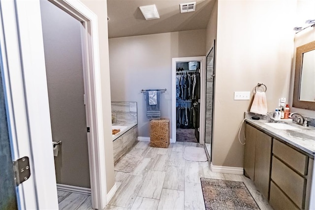 2713 Falling Leaves Dr, Weatherford, OK 73096 - full bath with a garden tub, vanity, and a spacious closet