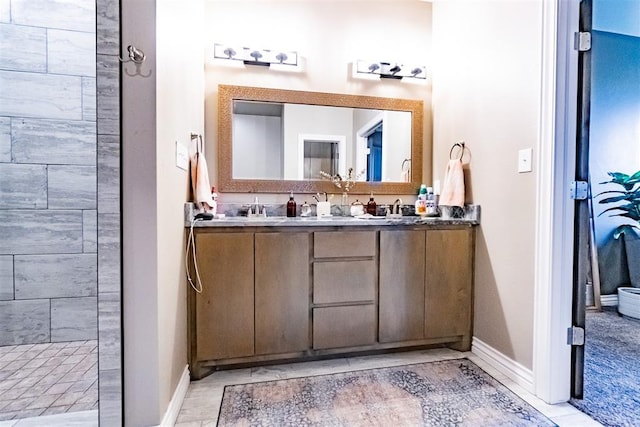 2713 Falling Leaves Dr, Weatherford, OK 73096 - bathroom featuring double vanity and a tile shower