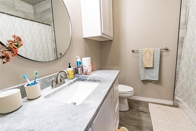 2713 Falling Leaves Dr, Weatherford, OK 73096 - bathroom featuring vanity, wood finished floors, and a shower with curtain