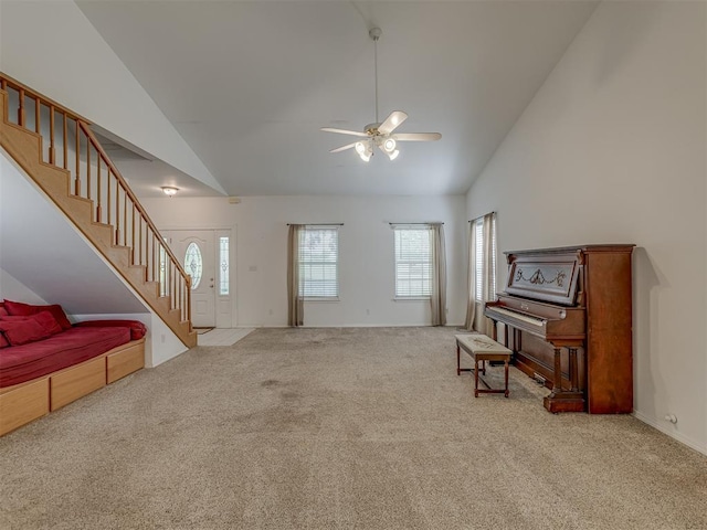 4919 E Lone Chimney Rd, Glencoe, OK 74032 - sitting room with stairway, carpet flooring, high vaulted ceiling, and ceiling fan