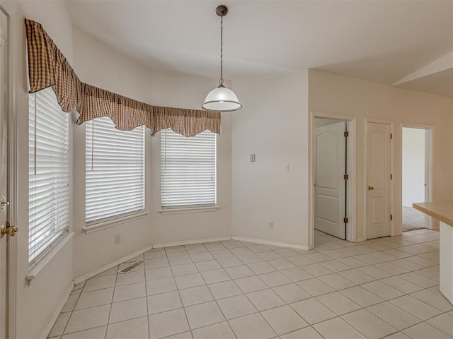 4919 E Lone Chimney Rd, Glencoe, OK 74032 - unfurnished dining area with baseboards and light tile patterned floors