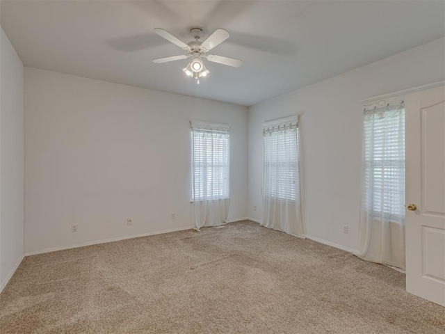 4919 E Lone Chimney Rd, Glencoe, OK 74032 - spare room featuring light carpet and a ceiling fan