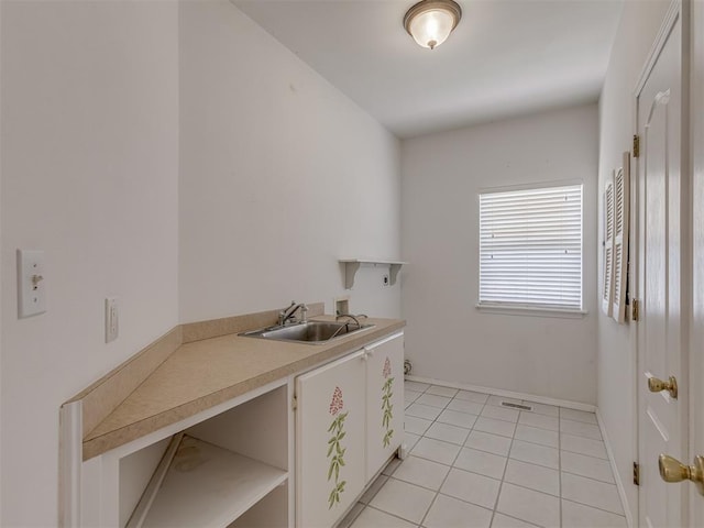 4919 E Lone Chimney Rd, Glencoe, OK 74032 - washroom with washer hookup, light tile patterned flooring, and hookup for an electric dryer
