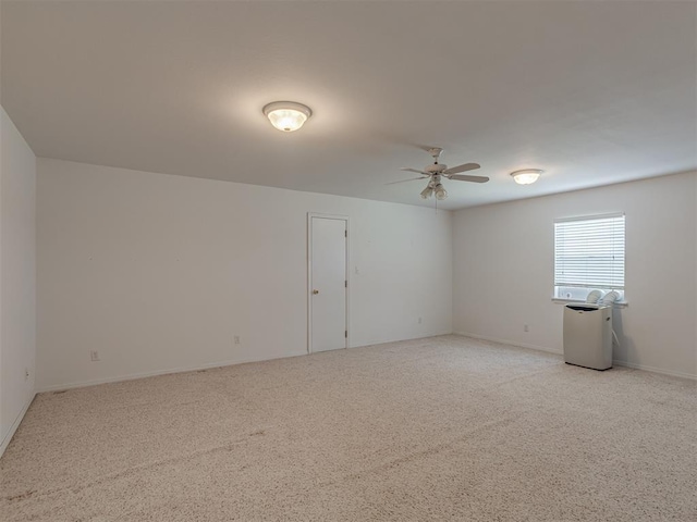 4919 E Lone Chimney Rd, Glencoe, OK 74032 - spare room with ceiling fan and light colored carpet