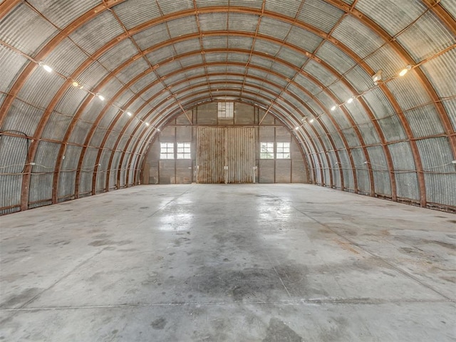 4919 E Lone Chimney Rd, Glencoe, OK 74032 - miscellaneous room with unfinished concrete floors and vaulted ceiling