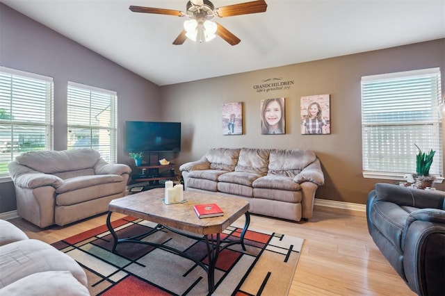 1609 NW 144th Ter, Edmond, OK 73013 - living area with vaulted ceiling, light wood-type flooring, and a ceiling fan