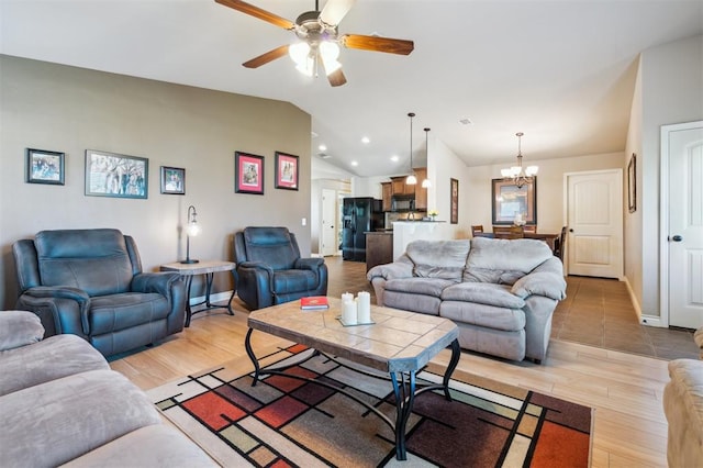 1609 NW 144th Ter, Edmond, OK 73013 - living room with a chandelier, lofted ceiling, ceiling fan, light wood-style floors, and recessed lighting