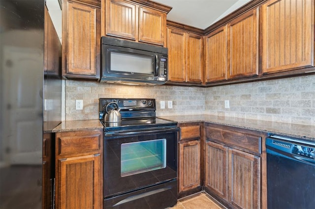1609 NW 144th Ter, Edmond, OK 73013 - kitchen featuring black appliances, light stone countertops, tasteful backsplash, and brown cabinetry