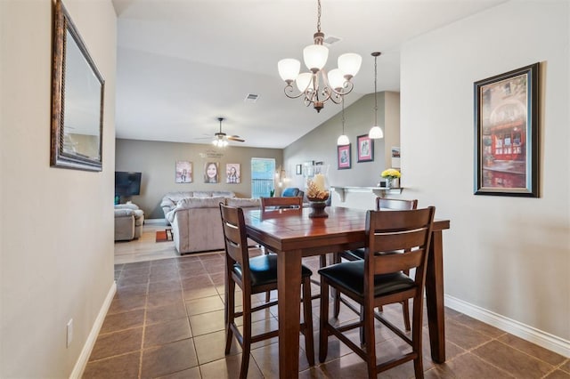1609 NW 144th Ter, Edmond, OK 73013 - dining area with a chandelier, dark tile patterned floors, and ceiling fan