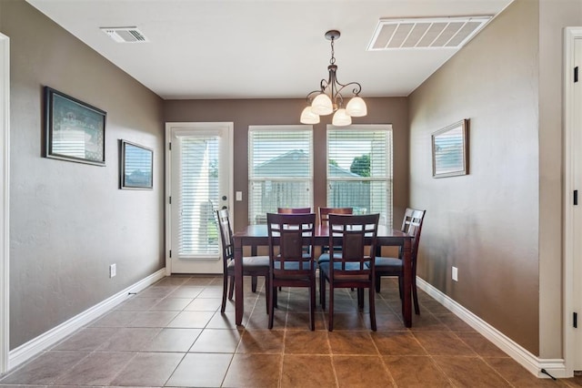 1609 NW 144th Ter, Edmond, OK 73013 - dining space featuring a chandelier and tile patterned floors