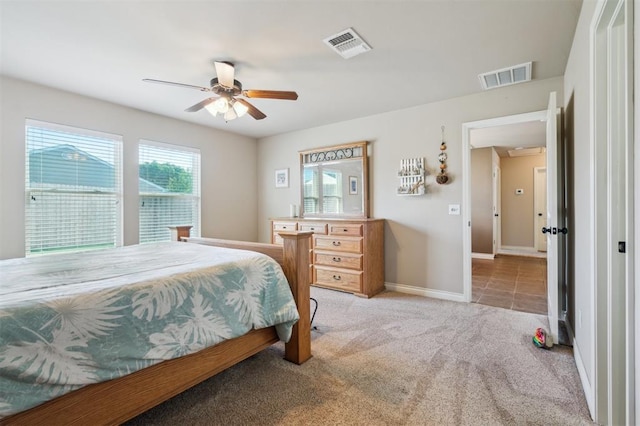1609 NW 144th Ter, Edmond, OK 73013 - bedroom with light carpet and a ceiling fan