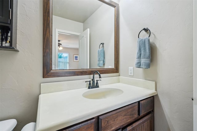 1609 NW 144th Ter, Edmond, OK 73013 - half bath featuring vanity, a textured wall, and ceiling fan