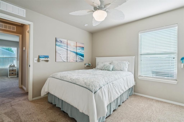 1609 NW 144th Ter, Edmond, OK 73013 - bedroom with light colored carpet and ceiling fan