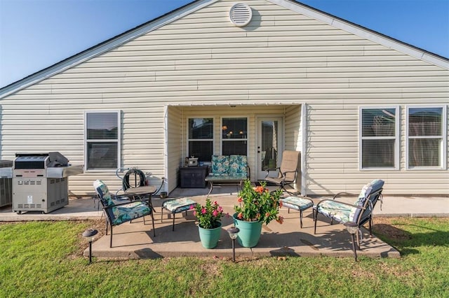 1609 NW 144th Ter, Edmond, OK 73013 - back of house with a patio and a lawn