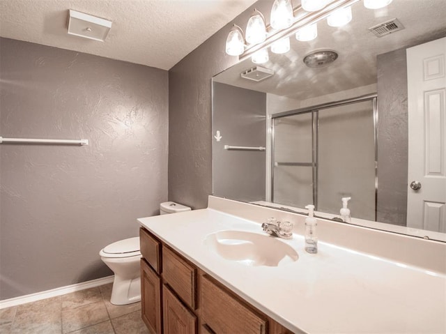 3003 River Oaks Dr Unit 119, Norman, OK 73072 - full bathroom featuring a textured wall, vanity, a textured ceiling, and a shower with shower door