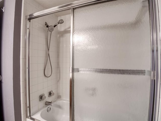 3003 River Oaks Dr Unit 119, Norman, OK 73072 - bathroom featuring enclosed tub / shower combo