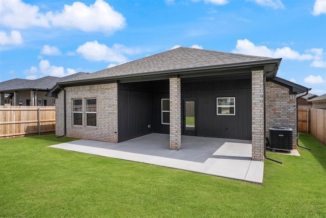 3825 NW 176th St, Edmond, OK 73012 - rear view of house featuring roof with shingles, a fenced backyard, a patio, and board and batten siding