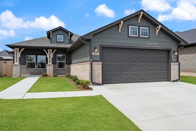 3825 NW 176th St, Edmond, OK 73012 - craftsman inspired home featuring brick siding, driveway, roof with shingles, and an attached garage