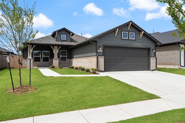 3825 NW 176th St, Edmond, OK 73012 - craftsman-style house featuring brick siding, concrete driveway, an attached garage, and a shingled roof