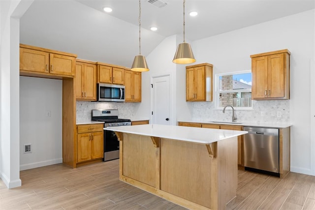 3825 NW 176th St, Edmond, OK 73012 - kitchen with stainless steel appliances, light countertops, backsplash, light wood-style flooring, and a kitchen island
