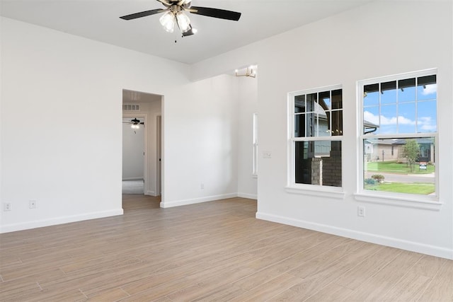 3825 NW 176th St, Edmond, OK 73012 - empty room with a ceiling fan and light wood finished floors