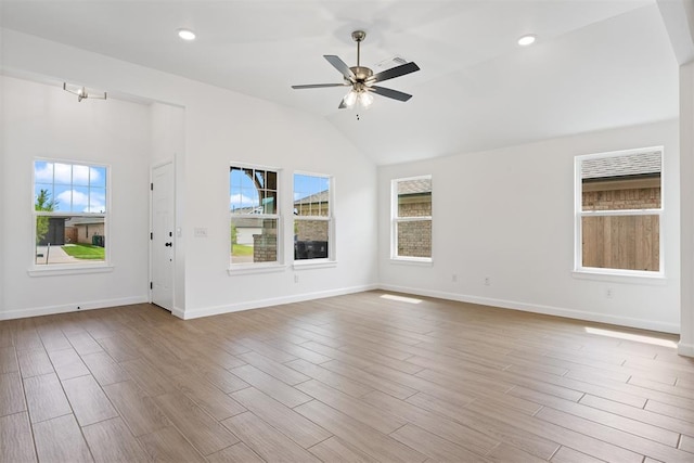 3825 NW 176th St, Edmond, OK 73012 - empty room with ceiling fan, vaulted ceiling, wood finished floors, and recessed lighting
