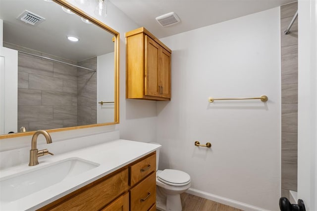 3825 NW 176th St, Edmond, OK 73012 - full bathroom with vanity, wood finished floors, and a tile shower