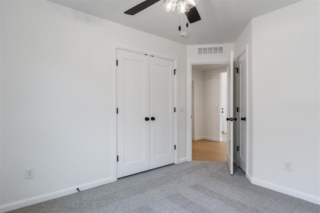 3825 NW 176th St, Edmond, OK 73012 - unfurnished bedroom with carpet flooring, a ceiling fan, and a closet