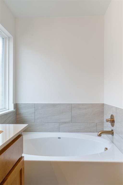 3825 NW 176th St, Edmond, OK 73012 - bathroom featuring vanity and a garden tub