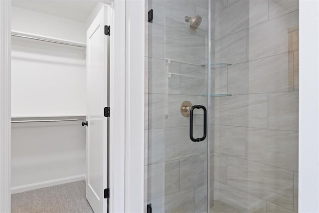 3825 NW 176th St, Edmond, OK 73012 - bathroom featuring a shower stall and a spacious closet