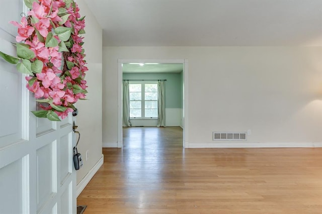 5932 N Grove Ave, Oklahoma City, OK 73122 - foyer with light wood-type flooring and baseboards