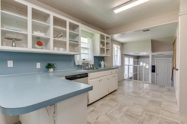 5932 N Grove Ave, Oklahoma City, OK 73122 - kitchen with open shelves, white cabinets, light marble finish flooring, and a peninsula