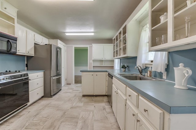 5932 N Grove Ave, Oklahoma City, OK 73122 - kitchen featuring appliances with stainless steel finishes, white cabinetry, glass insert cabinets, open shelves, and a peninsula